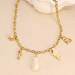 Collier coquillage doré femme à charms hippocampe, dauphins, coquillages naturels et perles nacrées