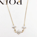 Collier étoile doré femme à trio d'étoiles pavées de cristaux et petits strass ronds sur chaîne fine