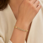 Bracelet doré femme motif infini et trèfles élégants