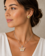 Parure bicolore collier papillon et puces fleur femme