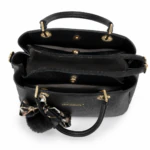 Sac à main noir ouvert vu de dessus : compartiments, poche zippée centrale et doublure grise