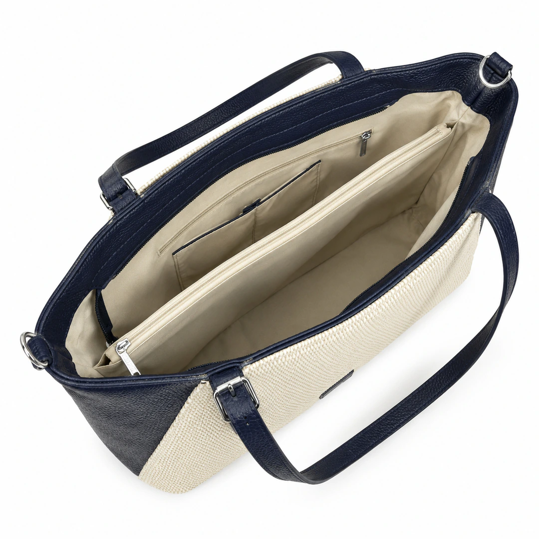 Sac cabas ouvert vu de dessus : doublure beige, compartiment zippé central et poches intérieures